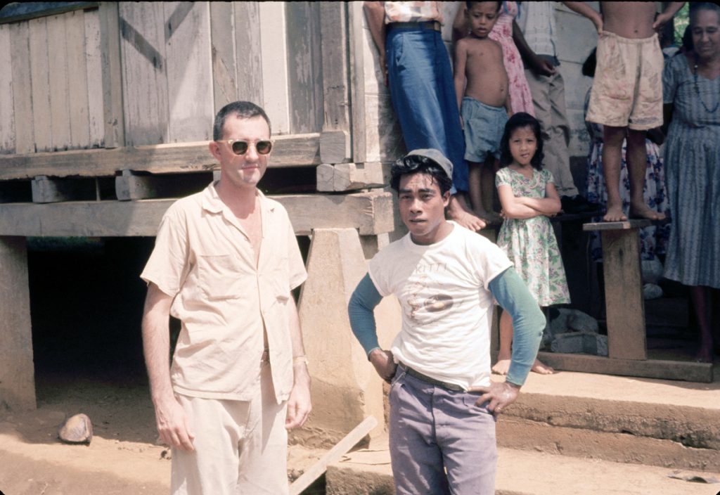 Father Bill McGarry, SJ, with a local family in local Pohnpei family, circa 1960
